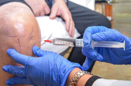 Patient receiving prolotherapy injection